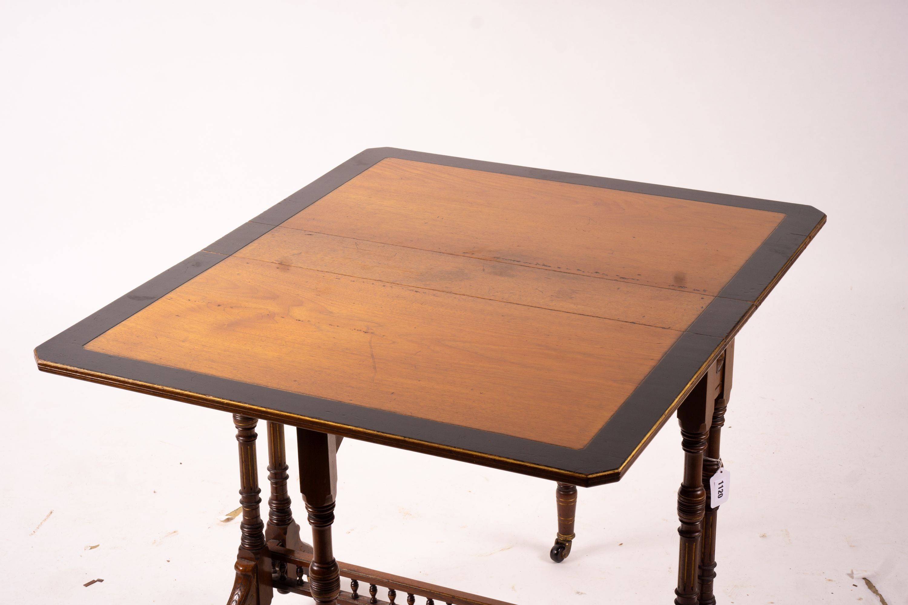 A late Victorian part ebonised walnut Sutherland table, width 76cm, depth 15cm, height 65cm